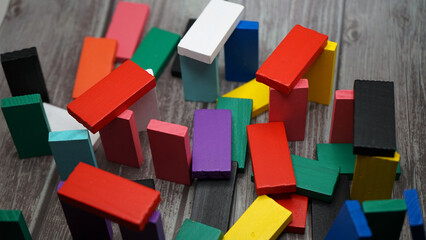 Obraz premium colorful bricks on white backgrounds in different positions and shapes making buildings