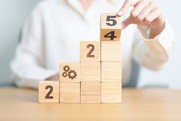 2024 year change to 2025 year block with gear icon. Business Process, Team, teamwork, Goal, Target,...