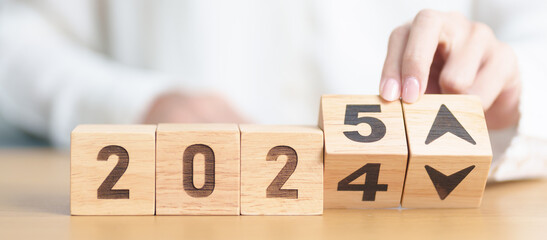2024 to 2025 New year with UP and Down arrow. Interest rate, GDP, stocks market, financial,...
