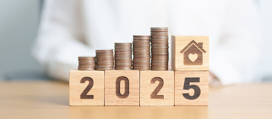 Happy New Year 2025 with house model. real estate, Home loan and mortgage, tax, investment,...
