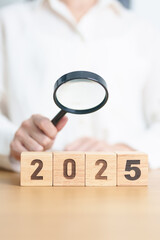 Happy New Year 2025 with magnifying glass and people. hiring, employee, recruitment, job, SEO and jobless concept