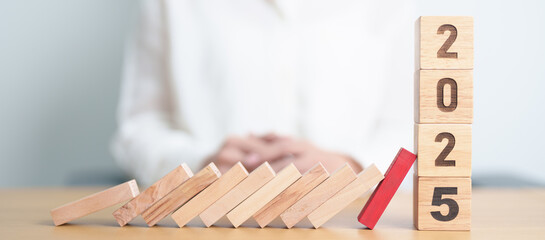 2025 year with falling blocks on table, Risk Management, recession, business financial, Resolution, strategy, goal, New Year planning and inflation deflation and economic recession concepts