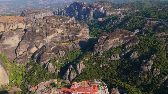 Greece Meteora region unique mountain formations and monasteries on it 4k videos taken with drone at sunrise