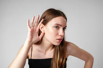 Fototapeta premium Young Woman Listening Attentively to a Conversation