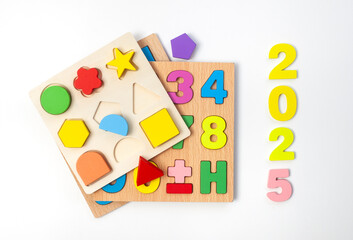 Children’s educational puzzles with the numbers 2025 for the new year ahead.
Isolated on white with copy space
