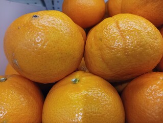 Close-up of Several Ripe Oranges in a Pile