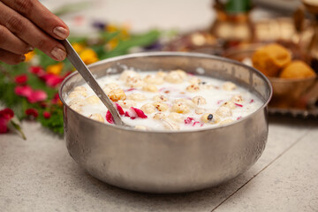 Preparing panchamrit for prasad distribution on the occasion of 'Krishna Janmashtami'.