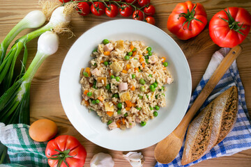 Brown rice with vegetables and turkey cubes. Top view.