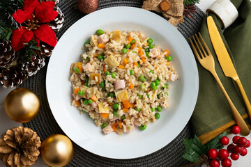 Brown rice with vegetables and turkey cubes. Top view table with christmas decoration.