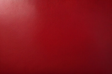 Abstract background of rich red leather with a glossy finish and subtle texture.