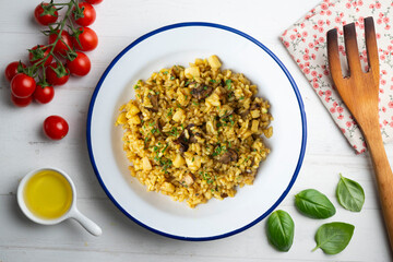 Arroz a banda. Rice paella with cuttlefish. Top view table.