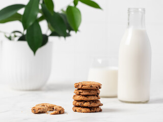 stacked chocolate chip cookies  on light background