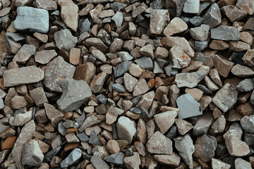 A close-up view of various sizes and shapes of gravel and stone aggregate found in a construction...
