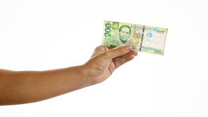 Hand holding a philippine 200 peso bill over isolated white background