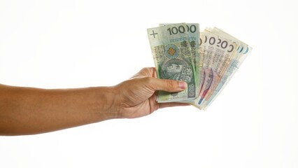 Hand holding several polish zloty banknotes over isolated white background, highlighting poland's currency in a simple yet impactful setting.