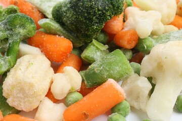 Mix of different frozen vegetables as background, closeup