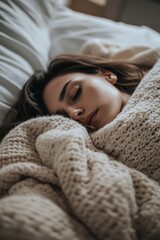 Close-up top-side view of Asian woman sleeping peacefully with blanket covering her, soft bokeh background, serene and tranquil moment