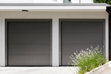 Garage Door Gate in Private Garage with Doudle Section. Double Garage with Automated Roller Doors.