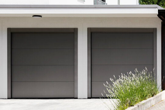 Garage Door Gate in Private Garage with Doudle Section. Double Garage with Automated Roller Doors.