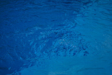 Beautiful turquoise blue water bubbling in a small whirlpool