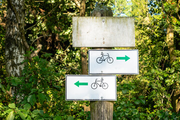 Signs show the way, Signs with directions for bicycles, Signs for tourists 