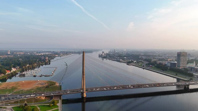 Aerial view of the Daugava River and Vansu Bridge in Riga early in the morning at dawn on a clear summer or autumn day, Latvia, Europe