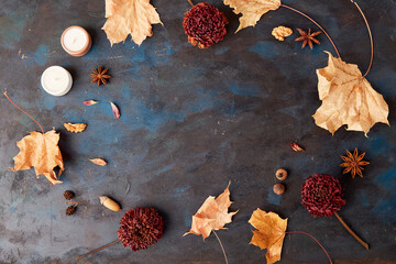 Dry flowers and leaves on rustic background. Zero waste, organic decorations. Autumn vibes...