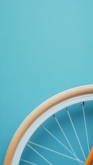 Close-up of a bicycle wheel against a vibrant blue wall, showcasing modern design and texture...