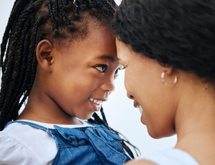 Black family, mother and forehead touch with child for love, trust and support in nature. Mom, girl...