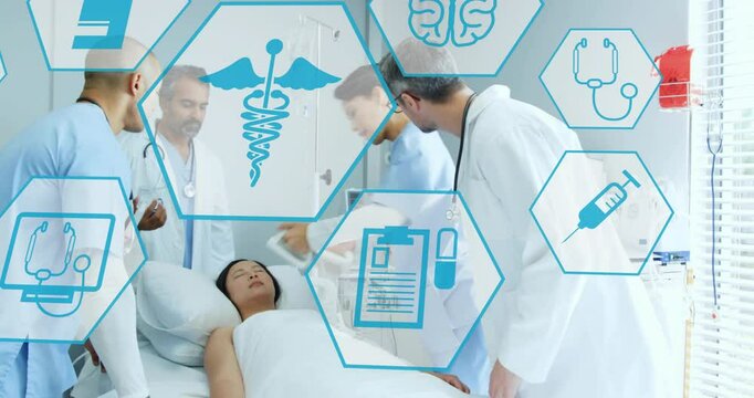 Animation of medical icons over diverse doctors using defibrillator on patient
