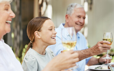 Family, champagne and toast for celebration, food and gathering for thanksgiving, love and reunion. Outdoor, party and grandparents with wine, cheers and dinner in holiday, house and child with smile