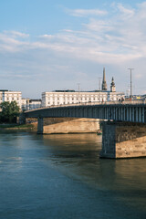 Naklejka premium Bridge Over the Danube in Linz with University of Linz and Cityscape View