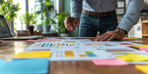 Fototapeta premium Group business people point to graphs and charts to analyze market data balance sheet account, Casual meeting diverse business team