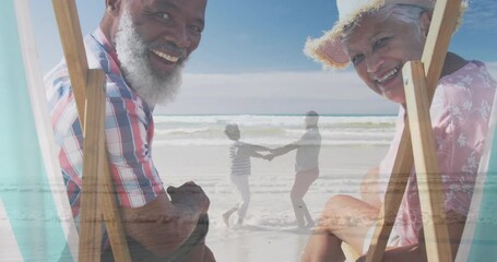 Animation of happy senior biracial couple over senior couple dancing at beach - Powered by Adobe