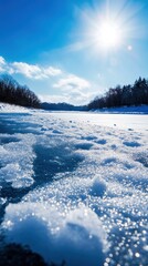 A serene winter landscape featuring a frozen river under a bright sun and blue sky, evoking calm and beauty in nature.