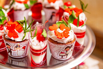 Delicious Wedding-Themed Desserts With Vibrant Decorations on a Silver Platter.