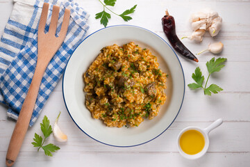 Rice paella with Iberian pork cheek. Top view table.