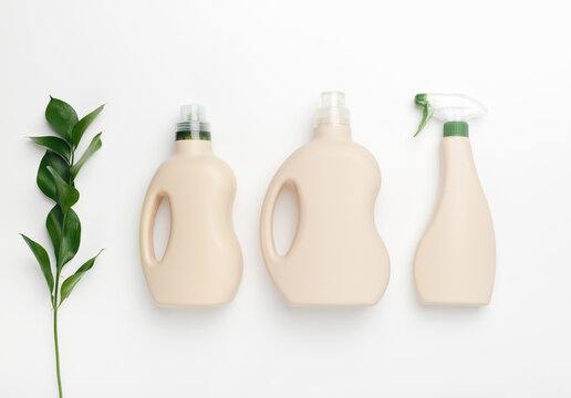 Set of bottles with mockup packaging, cleaning detergent on white background. Cleaning tools, cleanliness