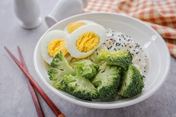 Steamed rice toped black sesame with boiled eggs and  broccoli ,healthy food, diet food