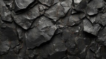 A matte black stone texture, rough and natural