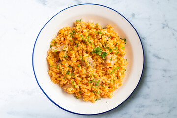 Rice paella with fresh tuna. Top view table.