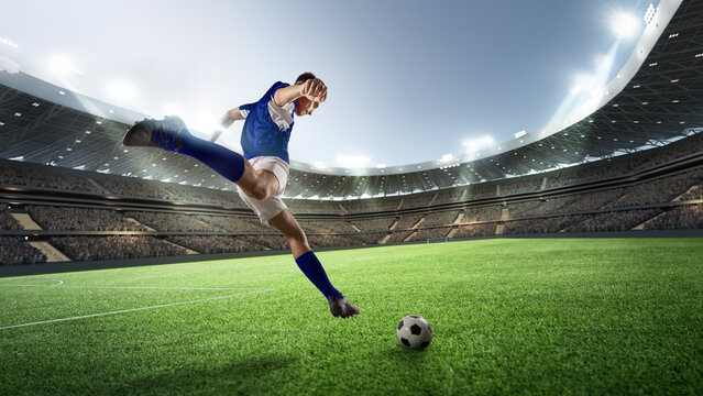Wearing blue jersey, professional soccer player strikes ball with precision, vibrant stadium backdrop amplifying intensity of thrilling match. Concept of sport games, competition, world cup.