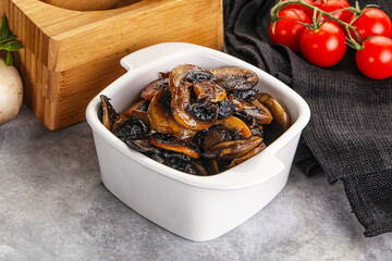 Roasted champignon mushrooms in the bowl