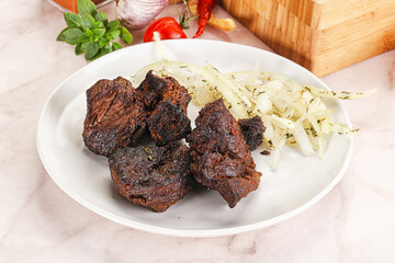Grilled beef barbecue served onion