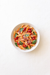 Pasta penne alla arrabiata with tomatoes, basil and parmesan cheese. Healthy Eating. Vegetarian...