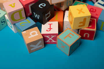 Colorful wooden blocks with letters spelling out words Learning the alphabet is fun