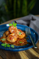 Italian meatballs in tomato sauce with fresh basil