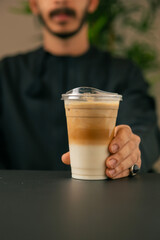 Preparing coffee with milk in the café