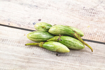 Small organic young green eggplant