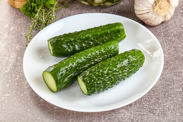 Homemade lighty salted cucumbers with herbs
